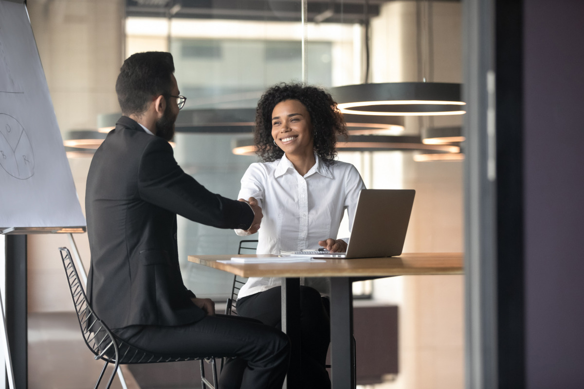 Two people shaking hands on a business meeting